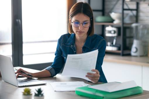 young woman working with computer while consulting utc resize