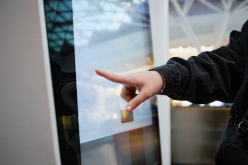 woman using touchscreen directory in mall utc resize